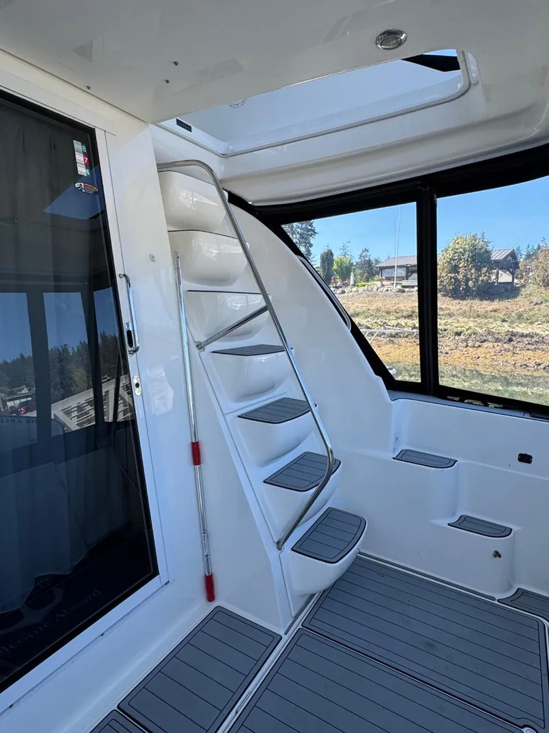Slide: The Image of 2003 Meridian 381 Sedan interior with sleek stairs and panoramic windows. - 9