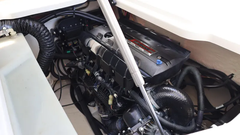 Slide: The Image of Engine compartment of a 2020 Yamaha Boats 275 SD, showcasing intricate mechanical components. - 16