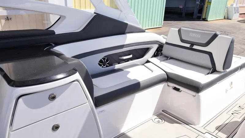 Slide: The Image of 2020 Yamaha Boats 275 SD interior with sleek seating and modern design. - 21