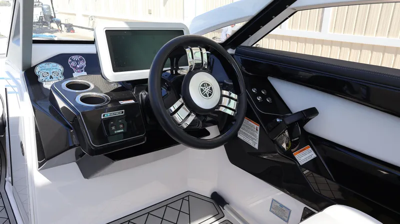 Slide: The Image of 2020 Yamaha Boats 275 SD helm with modern steering and touchscreen display. - 28