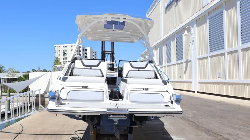 Slide: The Image of 2020 Yamaha Boats 275 SD on a dock, showcasing sleek design and spacious seating. - 3
