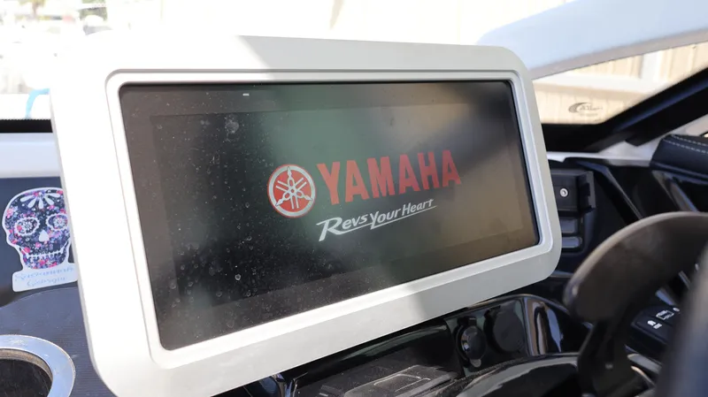 Slide: The Image of Dashboard of 2020 Yamaha Boats 275 SD with digital display and logo. - 31