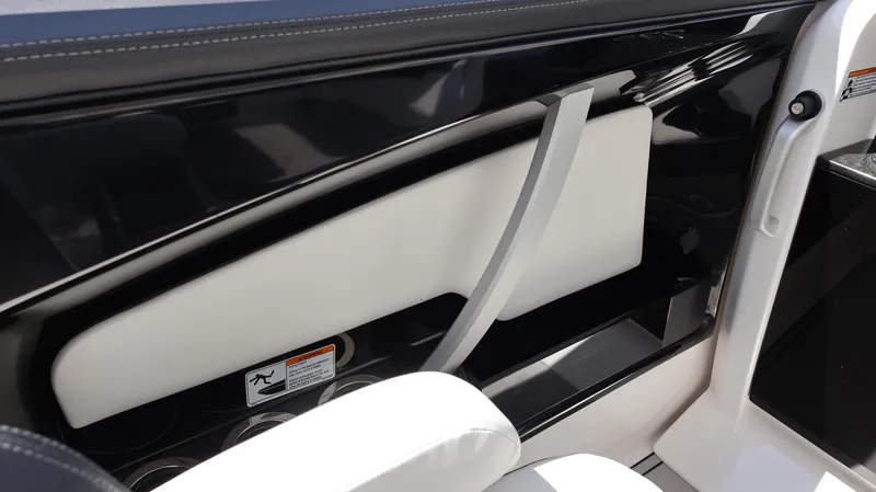 Slide: The Image of Interior view of 2020 Yamaha Boats 275 SD, featuring sleek black and white design. - 36