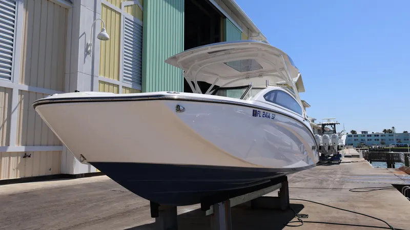 Slide: The Image of 2020 Yamaha Boats 275 SD on dock, showcasing sleek design and modern features. - 6