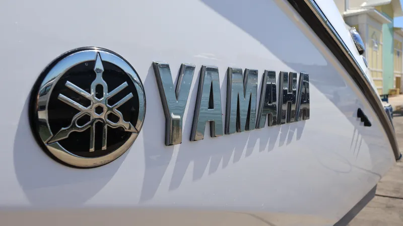 Slide: The Image of 2020 Yamaha Boats 275 SD logo on sleek white hull. - 7