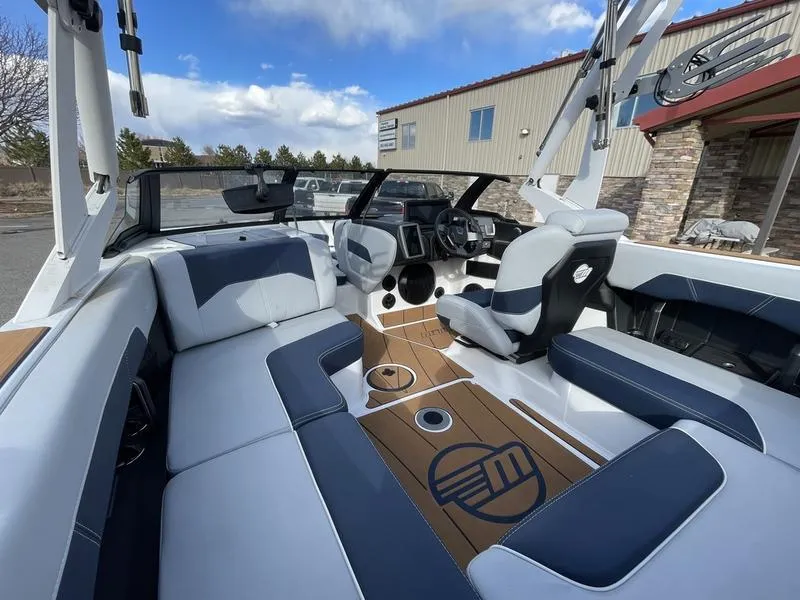 Slide: The Image of 2025 Malibu 20 VTX boat interior with modern seating and dashboard design. - 13