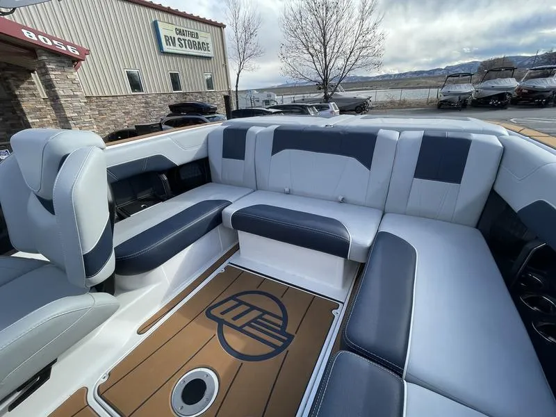 Slide: The Image of 2025 Malibu 20 VTX boat interior with sleek seating and stylish design. - 16