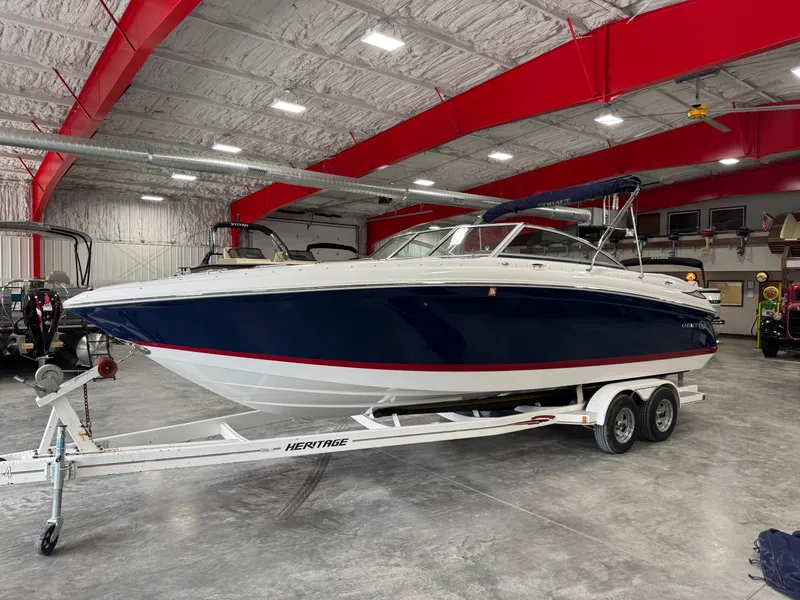 Slide: The Image of 2012 Cobalt 262 BR boat on trailer in indoor storage facility. - 1