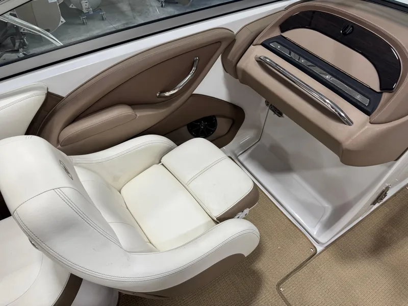 Slide: The Image of Interior of 2012 Cobalt 262 BR boat with white and beige seating. - 13
