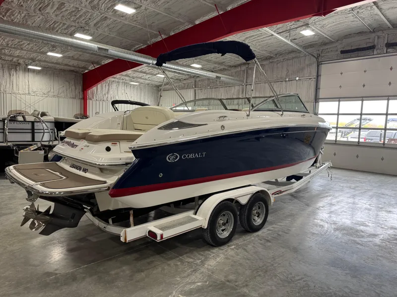 Slide: The Image of 2012 Cobalt 262 BR boat on trailer in indoor storage facility. - 5