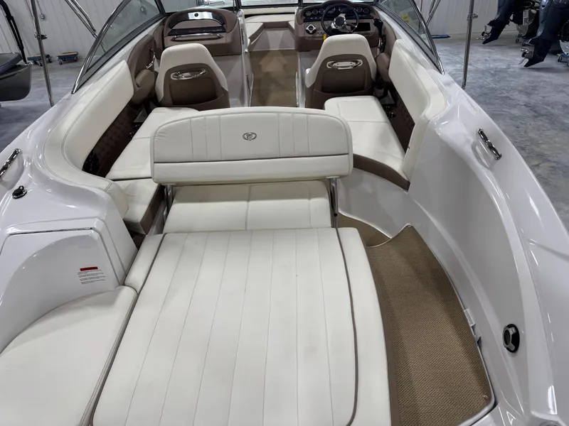 Slide: The Image of 2012 Cobalt 262 BR boat interior with white seating and sleek design. - 8