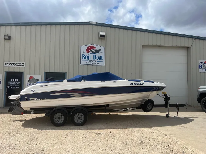 Slide: The Image of 2004 Chaparral 210 SSi boat on trailer outside Boji Boat Brokers building. - 0