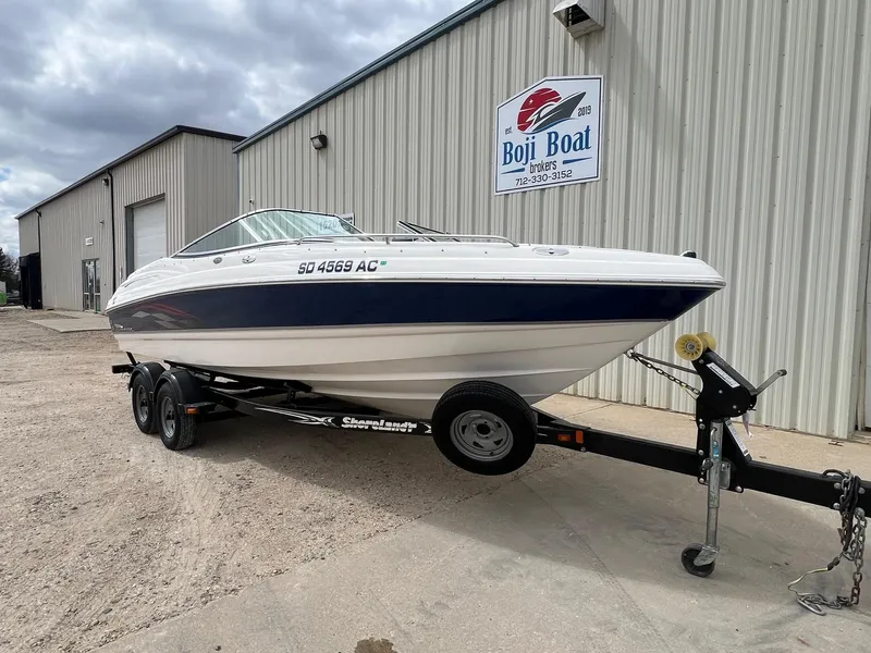 Slide: The Image of 2004 Chaparral 210 SSi boat on trailer outside Boji Boat Brokers building. - 1