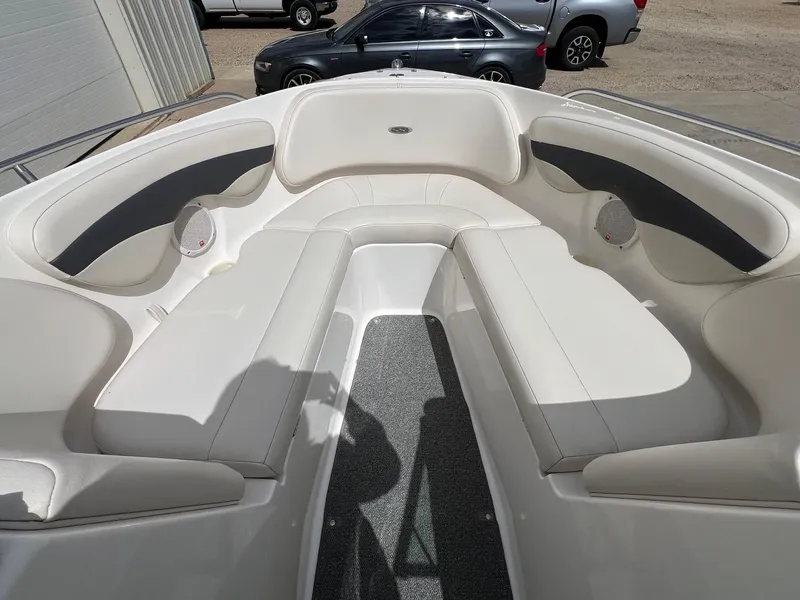 Slide: The Image of 2004 Chaparral 210 SSi boat interior with white seating and gray accents. - 10
