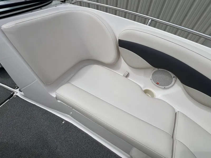 Slide: The Image of 2004 Chaparral 210 SSi boat interior seating with speaker and cup holder. - 13
