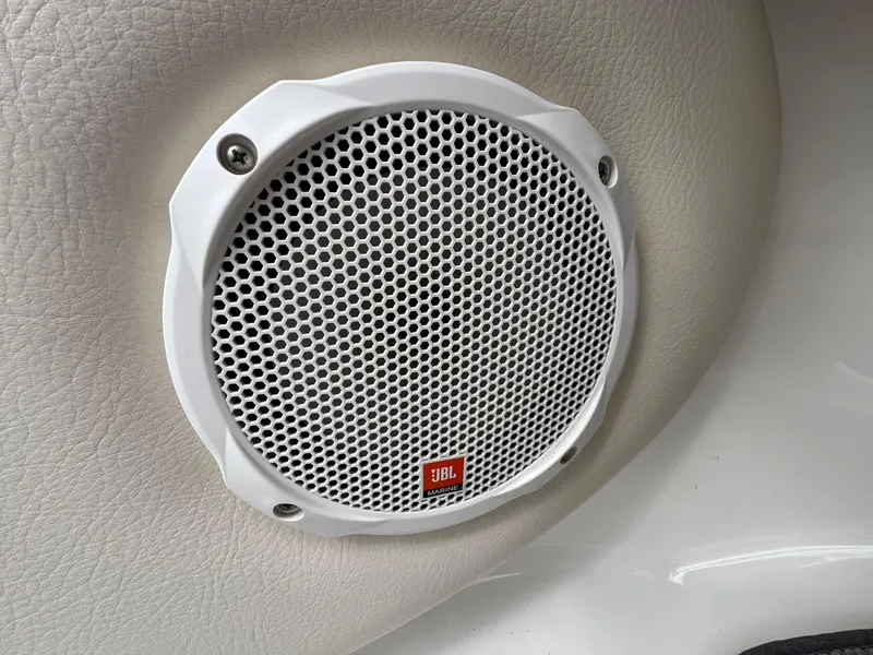 Slide: The Image of White JBL marine speaker on 2004 Chaparral 210 SSi boat interior. - 22