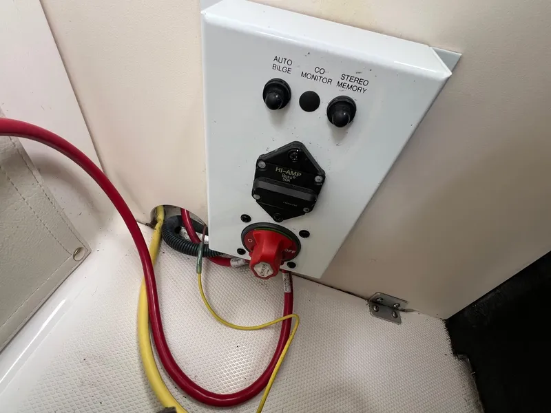 Slide: The Image of Control panel of a 2004 Chaparral 210 SSi boat with wiring and switches. - 27