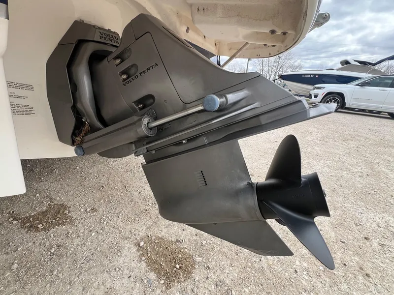 Slide: The Image of Close-up of a 2004 Chaparral 210 SSi boat's Volvo Penta outdrive on gravel. - 4