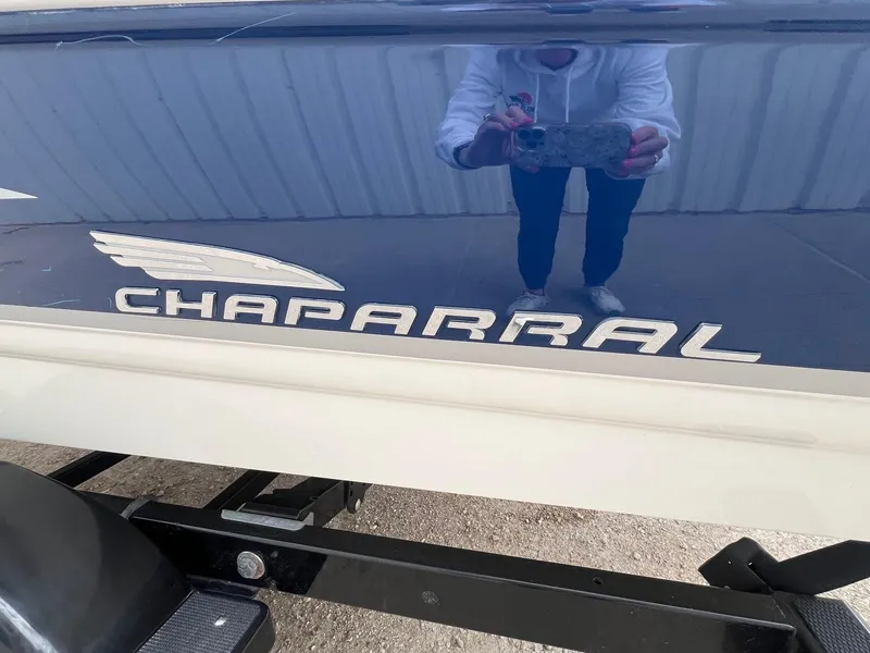 Slide: The Image of 2004 Chaparral 210 SSi boat with logo and reflection on hull. - 6