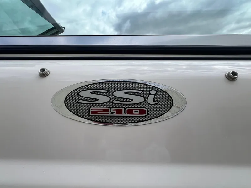 Slide: The Image of 2004 Chaparral 210 SSi boat emblem against cloudy sky background. - 7