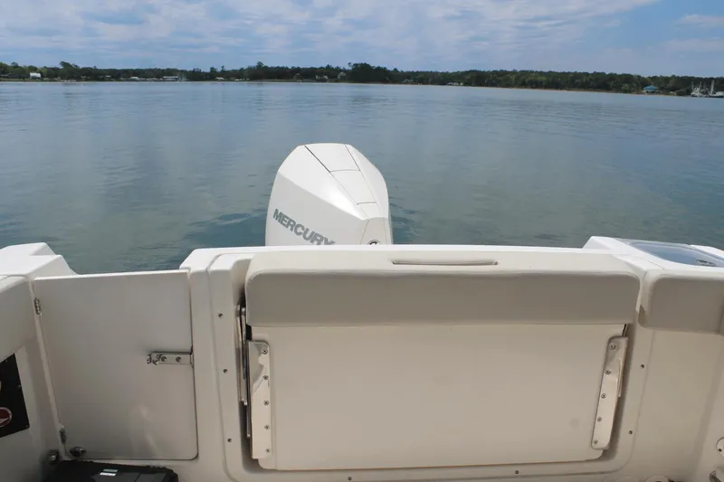 Slide: The Image of Boston Whaler 240 Vantage 2021 boat with Mercury engine on calm water. - 17