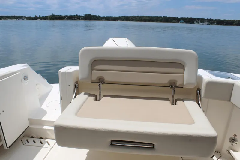 Slide: The Image of 2021 Boston Whaler 240 Vantage boat seat with scenic water view. - 19