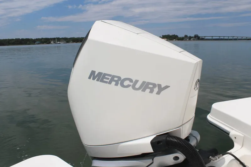 Slide: The Image of Mercury outboard engine on 2021 Boston Whaler 240 Vantage, calm water background. - 21