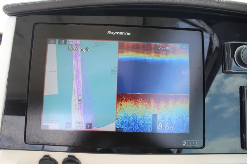 Slide: The Image of Raymarine navigation display on 2021 Boston Whaler 240 Vantage, showing speed and sonar depth. - 33