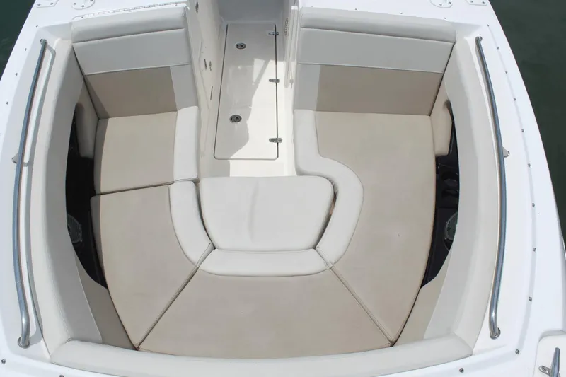 Slide: The Image of 2021 Boston Whaler 240 Vantage boat interior with cushioned seating area. - 37