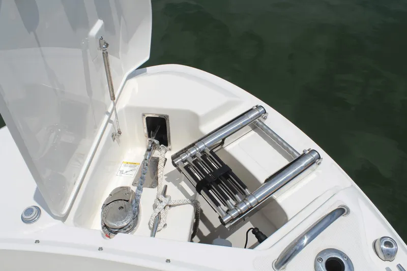 Slide: The Image of 2021 Boston Whaler 240 Vantage boat anchor storage and ladder detail. - 38