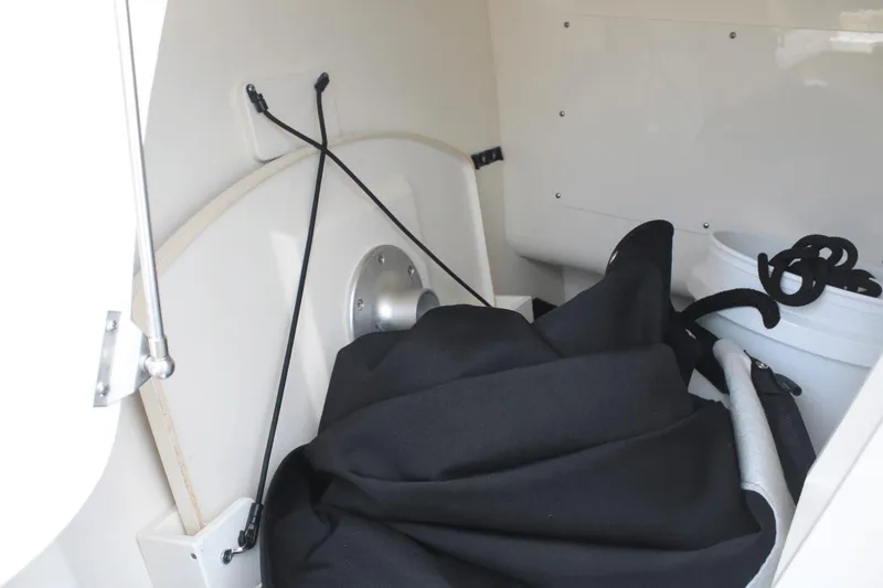 Slide: The Image of Interior storage area of a 2021 Boston Whaler 240 Vantage boat with equipment. - 40