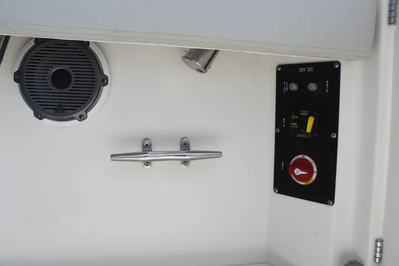 Slide: The Image of 2021 Boston Whaler 240 Vantage boat interior with speaker, cleat, and control panel. - 43