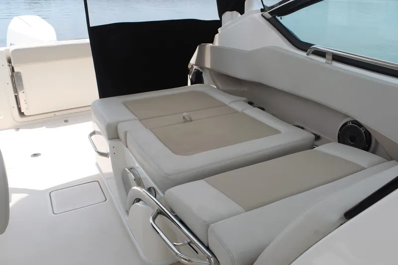Slide: The Image of 2021 Boston Whaler 240 Vantage interior seating with beige cushions and sleek design. - 44