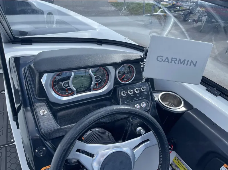 Slide: The Image of Cockpit of 2022 Scarab 255 ID boat with Garmin navigation system. - 4