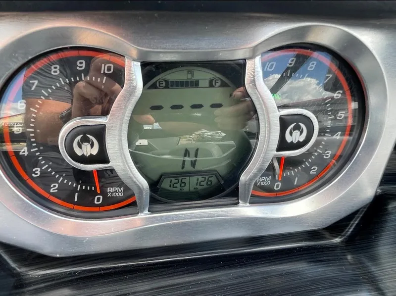 Slide: The Image of Dashboard of 2022 Scarab 255 ID showing RPM gauges and digital display. - 5