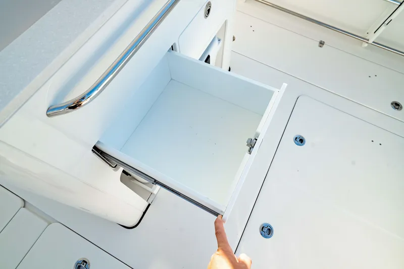 Slide: The Image of Open storage drawer on 2024 Edgewater 340CC boat deck. - 21