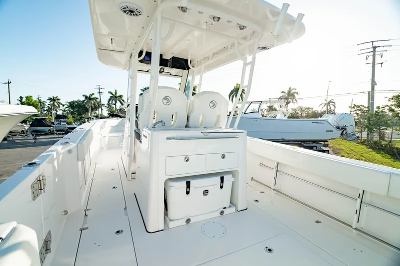 Slide: The Image of 2024 Edgewater 340CC boat interior with seating and storage, showcasing sleek design and functionality. - 3
