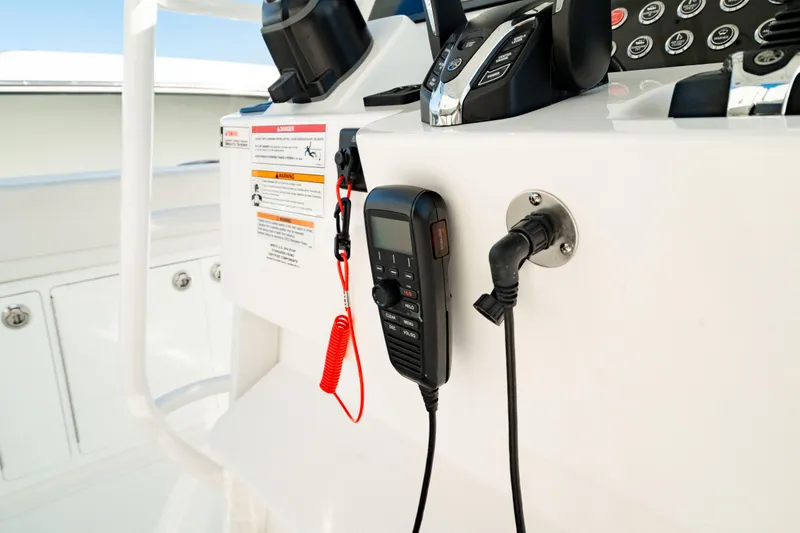 Slide: The Image of 2024 Edgewater 340CC boat console with communication equipment and controls. - 32