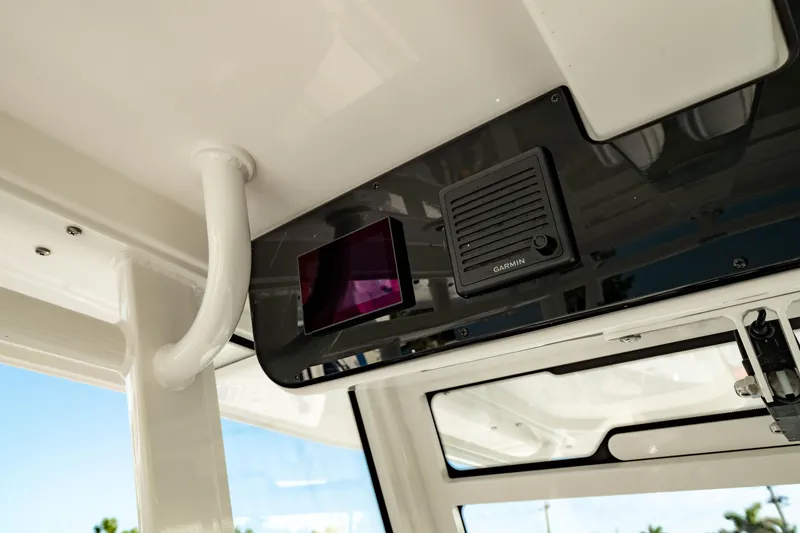Slide: The Image of 2024 Edgewater 340CC boat interior with Garmin electronics and modern design. - 34