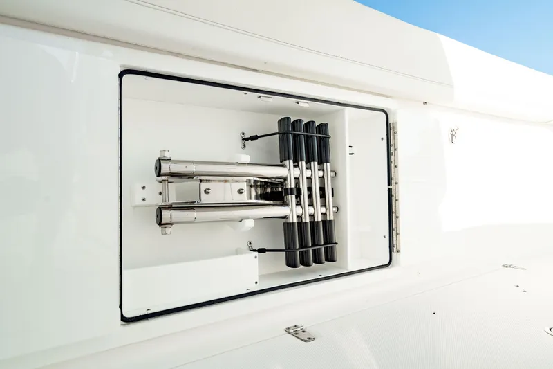 Slide: The Image of 2024 Edgewater 340CC boat ladder compartment with stainless steel fittings. - 38