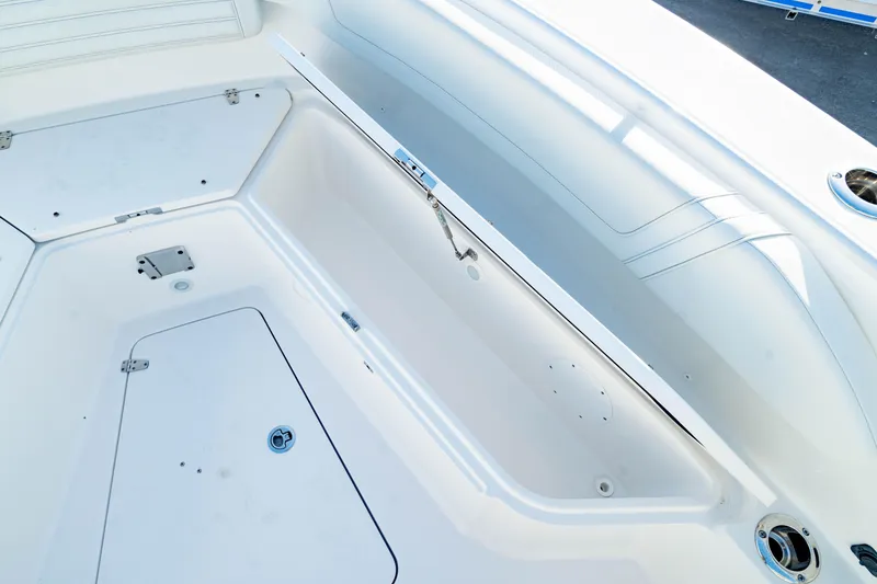 Slide: The Image of 2024 Edgewater 340CC boat interior storage compartment, featuring sleek design and ample space. - 48