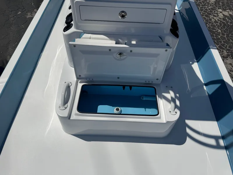 Slide: The Image of 2025 SCB R24 boat storage compartment with open lid, showcasing interior design. - 15