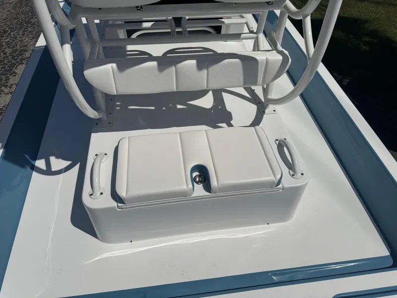 Slide: The Image of 2025 SCB R24 boat interior with white seating and storage compartment. - 28