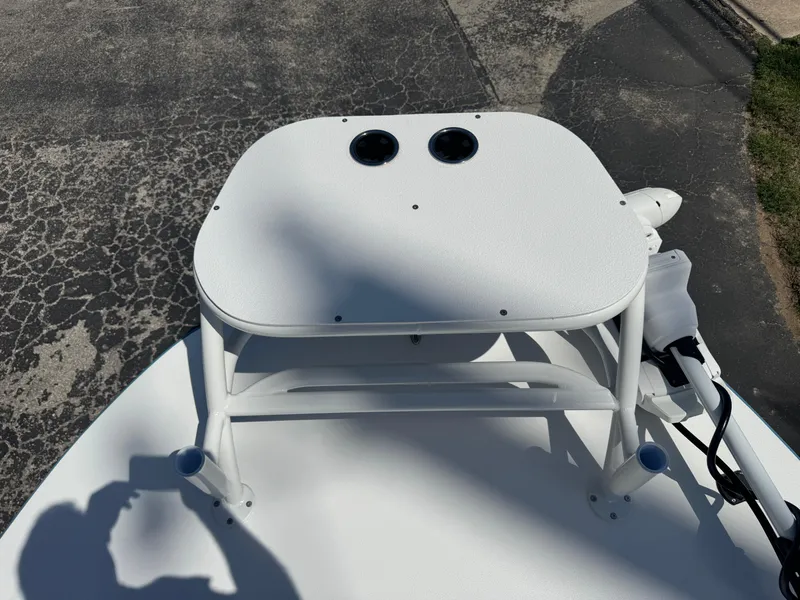 Slide: The Image of 2025 SCB R24 boat deck with dual cup holders, photographed outdoors. - 32