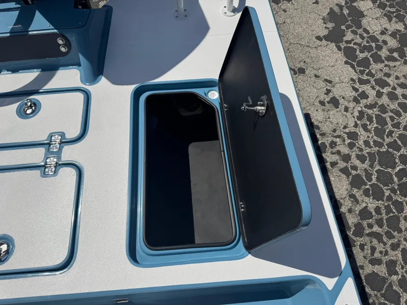 Slide: The Image of Open storage compartment on 2025 SCB R24 boat deck. - 36