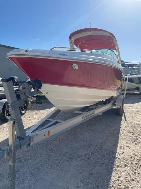 Slide: The Image of 2006 Chaparral 256 SSi boat on trailer, red and white exterior, sunny day. - 11