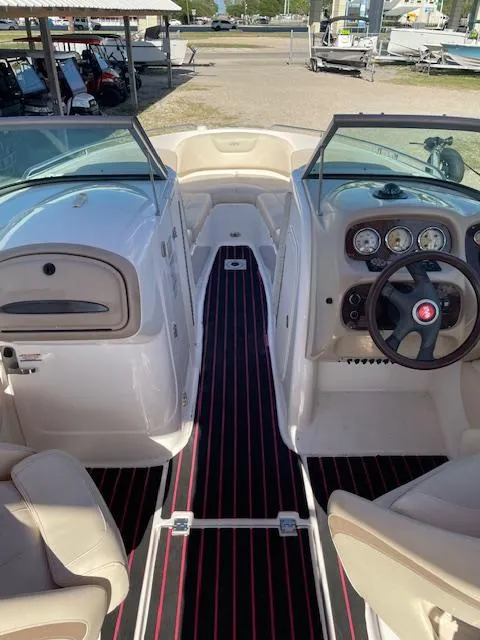 Slide: The Image of Interior view of 2006 Chaparral 256 SSi boat with dashboard and seating. - 6