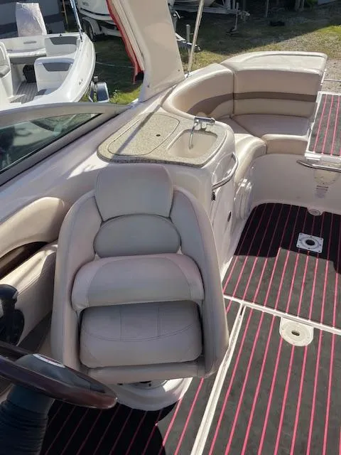 Slide: The Image of 2006 Chaparral 256 SSi boat interior with seating and steering area. - 8