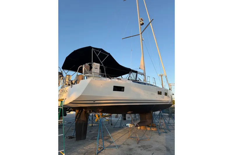 The Image of 2021 Jeanneau 54 yacht docked in Miami, featuring sleek design and modern amenities. - 0