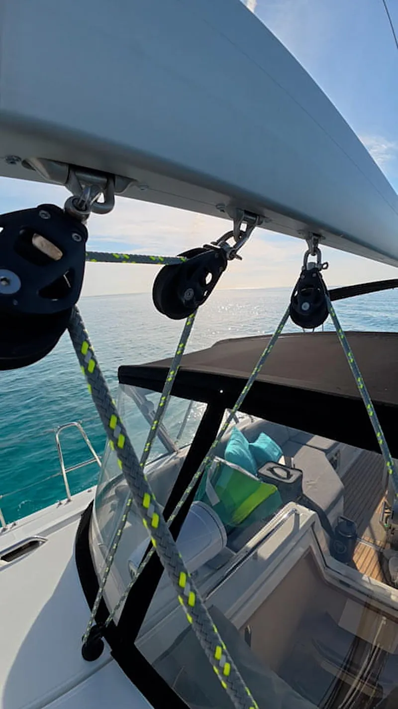 Slide: The Image of Sailing yacht Jeanneau 54, 2021 model, cruising on clear blue ocean waters. - 19